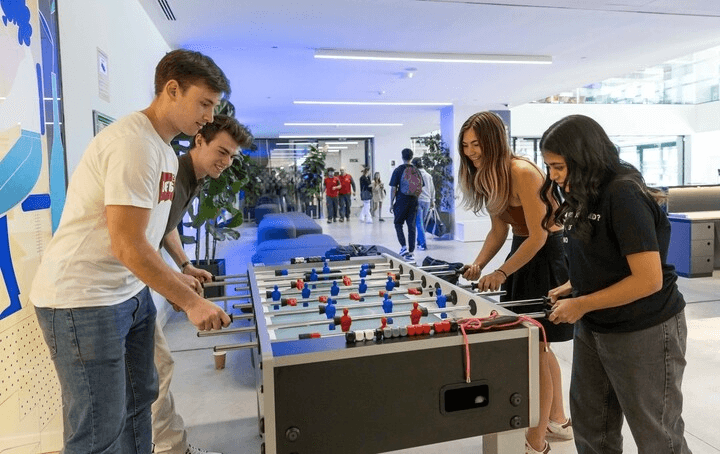 IE students playing  table football at IE tower