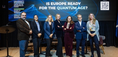 A group of professionals gathered at an event discussing the future of technology in Europe.