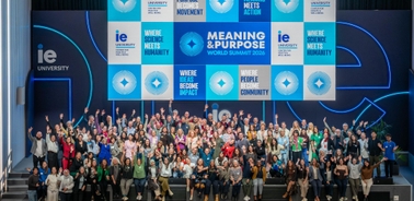 A large group of people gathered at an event promoting meaning and purpose.