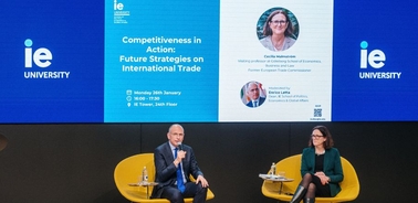 A panel discussion on international trade strategies featuring two speakers at an event.