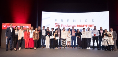 A group of award recipients and organizers gathered on stage at the Fundación MAPFRE event.