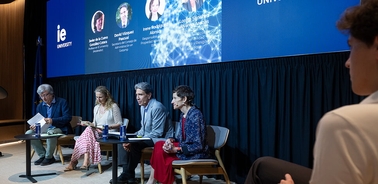 A panel discussion featuring multiple speakers at an event.