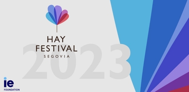 Promotional banner for Hay Festival Segovia 2023 featuring a colorful abstract symbol and diagonal color sections.
