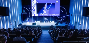 An audience listens to a speaker at the opening ceremony of IE University.