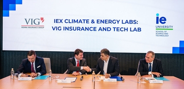 A business meeting taking place at IE University concerning climate and energy labs.