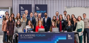 A diverse group of people gathered at a career forum event.