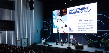 A panel discussion taking place at an Investment Banking Day event.
