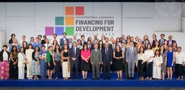 A diverse group of individuals gathered for the Financing for Development conference in Sevilla 2025.