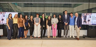 A group of professionals posing together at an event.