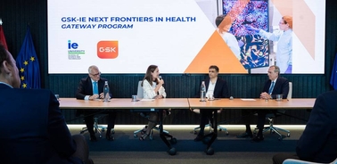 A panel discussion on health innovations featuring speakers and an engaging presentation backdrop.