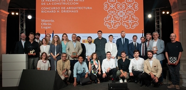A group of individuals posing for a photo at an architecture award ceremony.