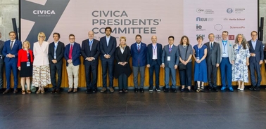A group of individuals standing together for a photo at the CIVICA Presidents' Committee event.
