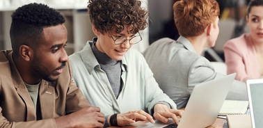 A group of professionals collaborating in a modern workspace.
