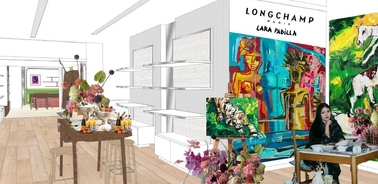 An artistic interior of a gallery featuring vibrant paintings and a woman working at a table amidst floral arrangements.
