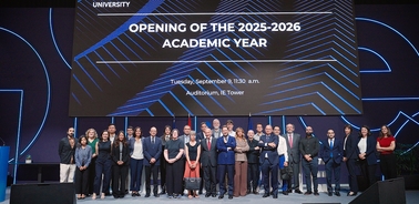 A group of people gathered for the opening of the 2025-2026 academic year at a university event.