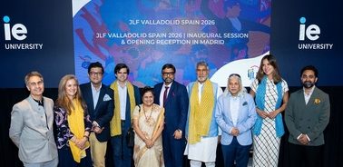 A group of people posing together at an event in Madrid.