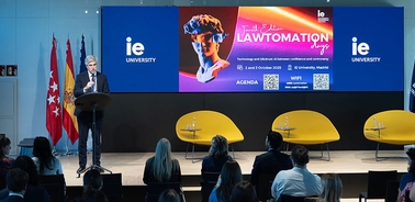 A speaker presenting at an event called Lawtomation Day at IE University.