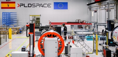 A modern workspace featuring industrial equipment and branding.