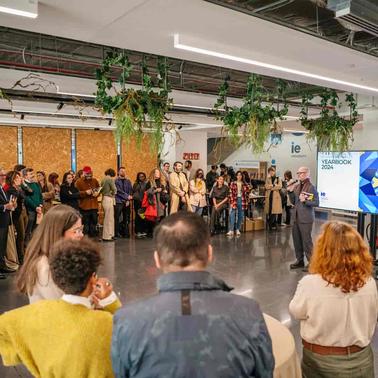 A diverse group of people attending an event in a modern space.