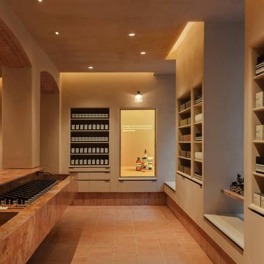 An elegantly designed wine cellar with shelving filled with numerous wine bottles and subtle lighting.