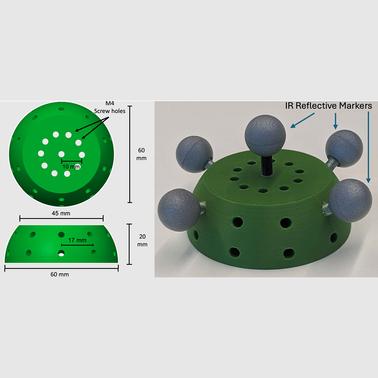 A green circular base with IR reflective markers and multiple screw holes.