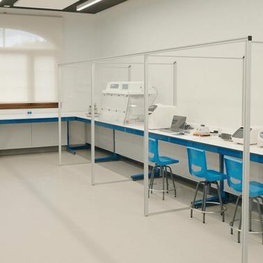 A clean, modern laboratory space equipped with workstations and various scientific instruments.