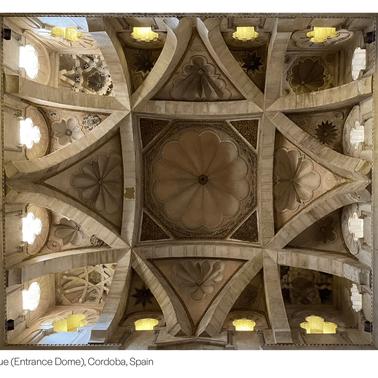 A stunning view of the intricately designed dome ceiling of the Cordoba Mosque in Spain.