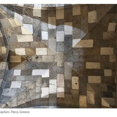 A detailed view of a patterned ceiling in a religious setting in Paros, Greece.