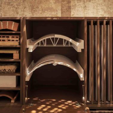 This image shows a wooden display with architectural models and materials.