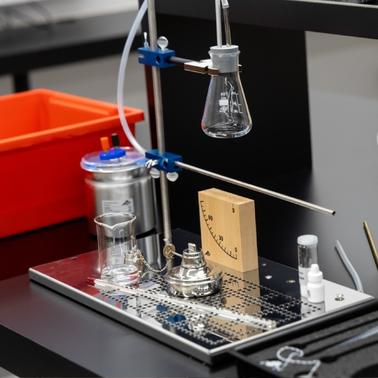 A laboratory setup featuring glassware and equipment for conducting experiments.