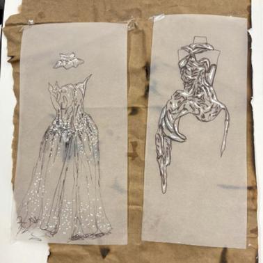 The image features two fashion design sketches of dresses drawn on parchment.