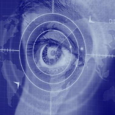 An eye overlaid with digital interfaces on a blue map background, symbolizing modern surveillance or data analysis.