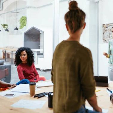A diverse group of professionals having a meeting in a modern office setting