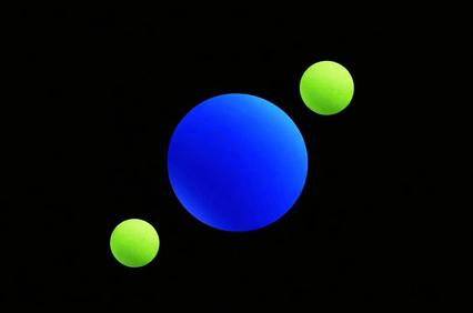 A blue planet with rings and two green moons in a starry space background.