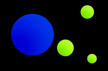 The image features various circles in vibrant colors against a black background.