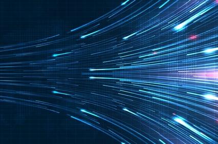 A dynamic representation of light streaks moving swiftly across a dark background.