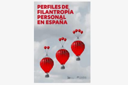 The image shows the cover of a book titled 'Perfiles de Filantropía Personal en España' featuring a design with red hot air balloons in the sky.
