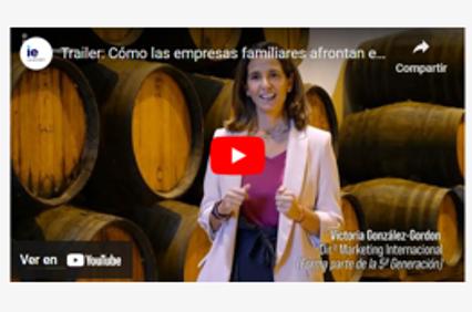 A screenshot of a YouTube video featuring a woman standing in front of wine barrels, discussing family businesses.