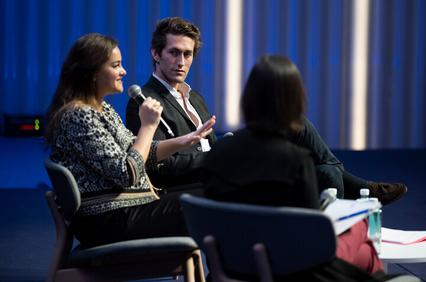 Woman speaking in a conference during an IE event