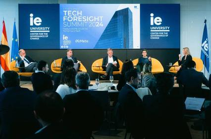 A panel discussion at the Tech Foresight Summit 2024 with speakers and audience in a conference room.