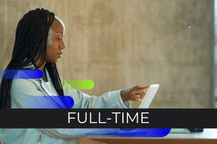 A woman with braided hair is focused on working on a tablet in an office setting, with the text 'FULL-TIME' displayed.