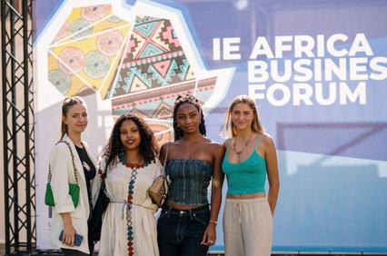 Four women standing together at the IE Africa Business Forum event.