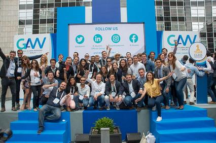 A large group of people gathered at an event, smiling and posing for a photo.