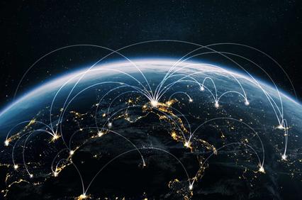 A digital depiction of the Earth from space showing illuminated cities connected by glowing arcs representing communication networks.