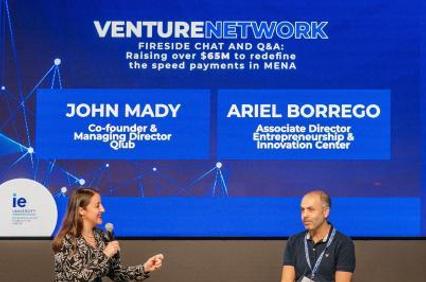 A panel discussion at IE University featuring two speakers discussing venture networks.