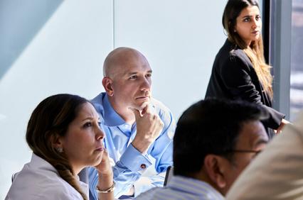 Global Executive MBA student paying attention during a class