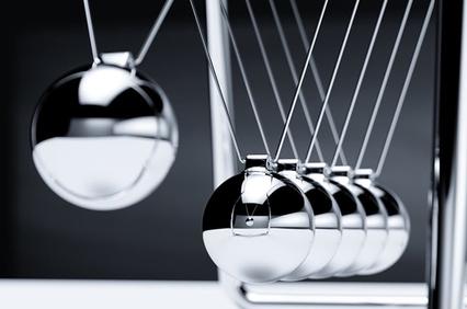 A set of metallic Newton's Cradle balls in motion.