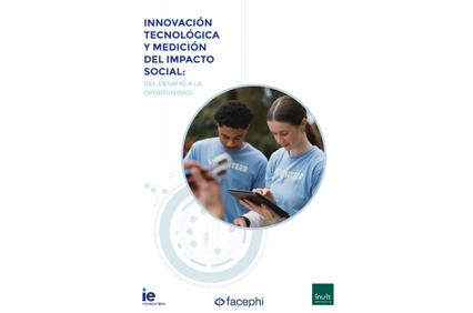 Two young adults, one male and one female, are engaged in using a digital device, possibly for a social impact project.