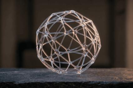 A translucent spherical structure composed of interconnected lines and nodes.