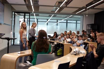 A classroom setting with students engaged during a presentation.